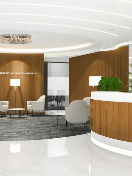 A 3D render of the proposed reception and lounge for Rays Power. This visual shows our planning for a spacious, brand-centric entrance with a green wall, comfortable seating, and even a product display area.