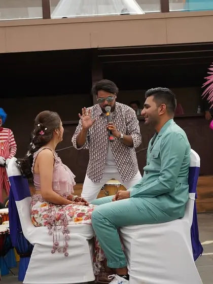 Another shot of me hosting a game with the couple at their carnival party. These personalized segments make the event unique and memorable.