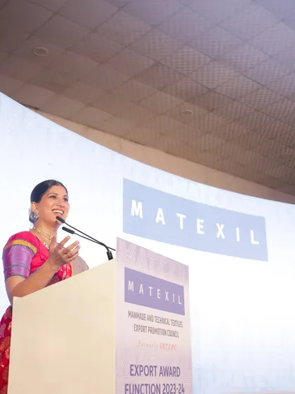 A candid moment of speaking at the MATEXIL awards, showing my passion and engagement with the subject matter.