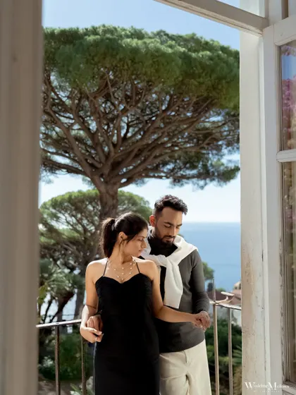 Framed by a window overlooking the Italian coast, this shot of Nisarg and Mansi feels like a scene from a film. We are always looking for unique perspectives to tell your story.