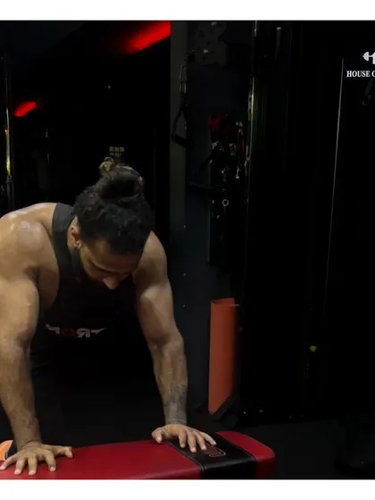 Let me reintroduce myself. A moment of recovery after a tough set, showing the definition that comes from dedicated upper body training.