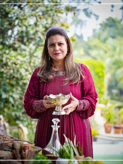 Sakshi Tuli on the set of a brand film, surrounded by a beautiful arrangement of fresh ingredients. Her work goes beyond catering, extending into the world of media and advertising.