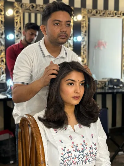 A close up of the blow dry curls demonstration. Notice the volume at the roots and the smooth finish on the ends, a technique we practice thoroughly in class.