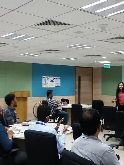 This photo shows a typical corporate workshop layout. The round tables encourage discussion and collaboration among participants as we work through different exercises.