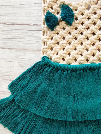 A final look at the beautiful details of the macrame dress hanging.