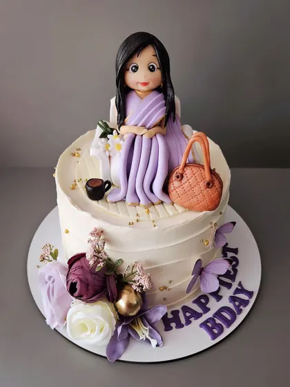 A beautiful cake for her, featuring a figurine in a lovely lavender saree. This 1.5kg chocolate truffle cake is perfect for a special birthday.