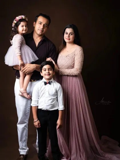 A stunning family portrait, with everyone dressed in coordinated colors for a timeless look.