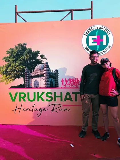 Posing at the Vrukshathon Heritage Run backdrop. Race trips are always a great adventure.