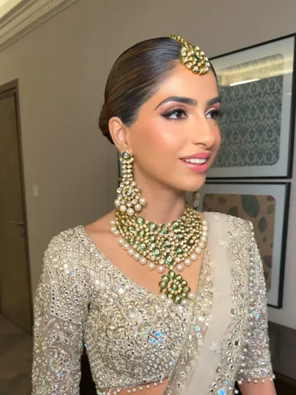 A profile view showing the soft, flushed complexion and defined eyes. This look was created using cream and liquid products to achieve a seamless, dewy finish that looks like second skin.