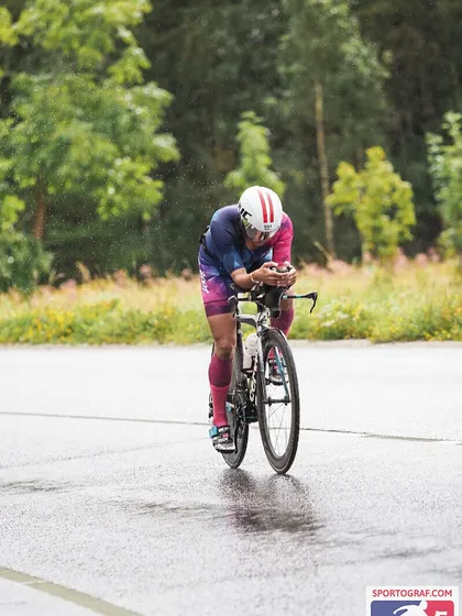 Maintaining an aero position on wet roads. This requires focus and bike handling skills. It's not just about power; it's about control.