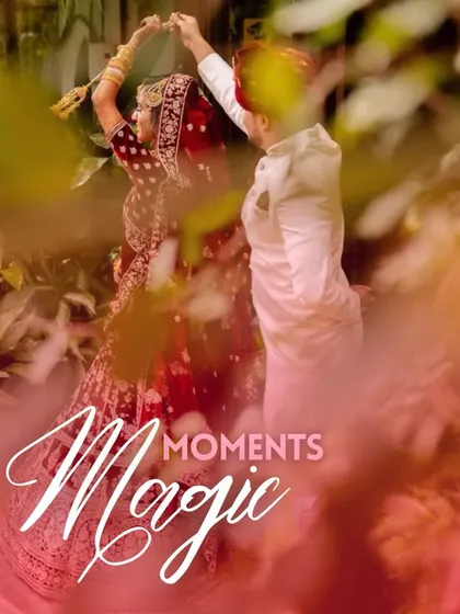 A candid, romantic shot of a couple dancing, framed by lush greenery and a touch of magical smoke.