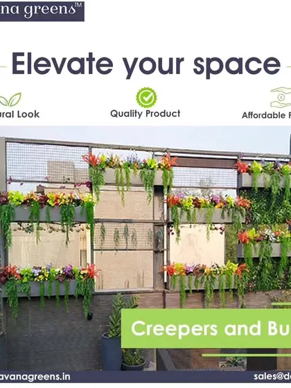 Elevate your space with our creepers and bushes. This outdoor installation uses planters with colorful, trailing flowers to decorate a modern facade, adding life and dimension.