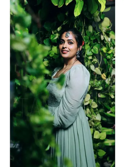 Looking so dreamy in this sage green georgette outfit. The dress features delicate embroidery on the bodice and romantic puff sleeves, perfect for a daytime event.
