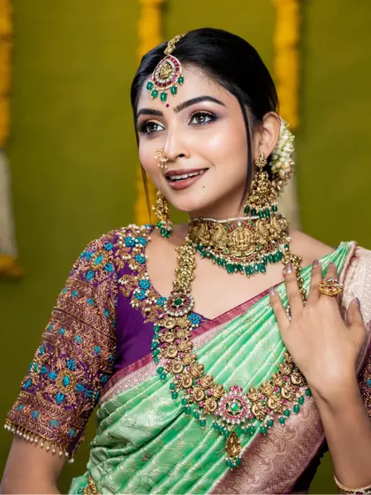 A close-up of the same look, showing the detail in the choker and haram.