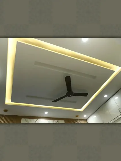 A classic square tray ceiling design, providing clean lines and balanced ambient light for a modern and uncluttered look.