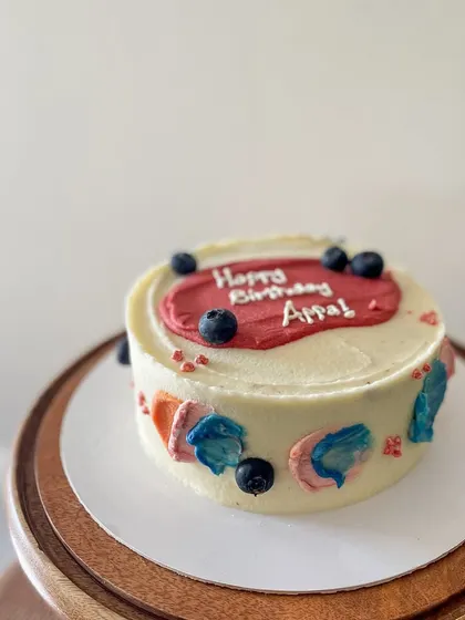 A simple and modern cake for Appa's birthday. This blueberry lemon curd cake is decorated with abstract buttercream swipes of color and fresh blueberries.