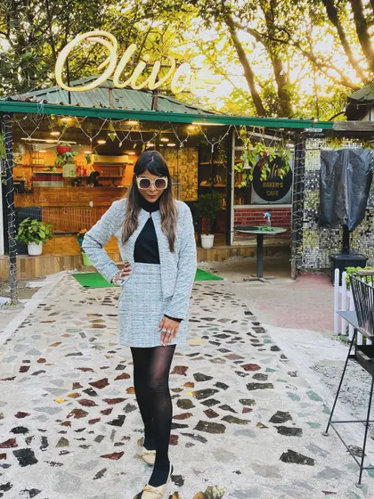 A full-length view of the tweed co-ord set. This is a great example of a polished winter outfit that isn't a heavy coat.