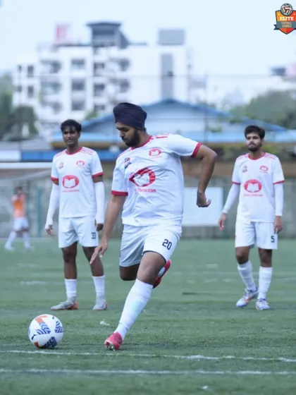 A player prepares to take a free-kick, a moment of precision and control that reflects our team's overall performance.
