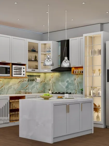 A wider view of the grey and green kitchen, showcasing the full layout with an island, integrated appliances, and glass-fronted display cabinets.