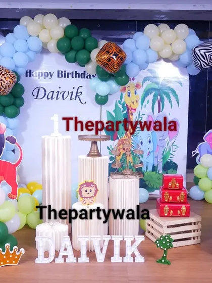 A jungle safari theme with a focus on friendly animal characters, perfect for a first birthday party.