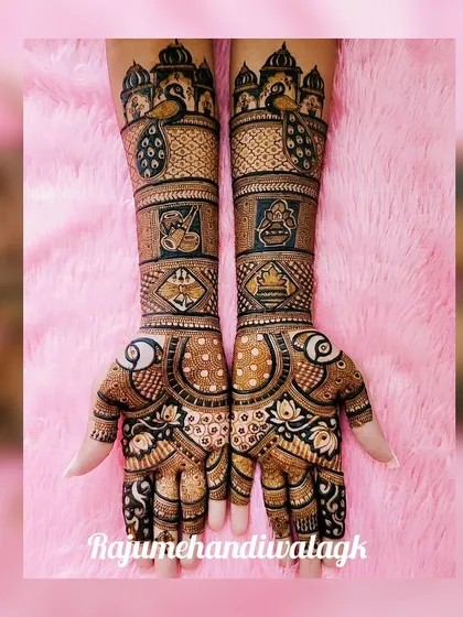 A grand design with palace architecture, peacocks, and auspicious symbols. This is a classic Rajasthani style of mehendi.
