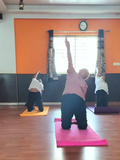 This is a kneeling side bend, a variation of Parighasana or Gate Pose. It provides a wonderful stretch for the side body, from the hips all the way to the fingertips.