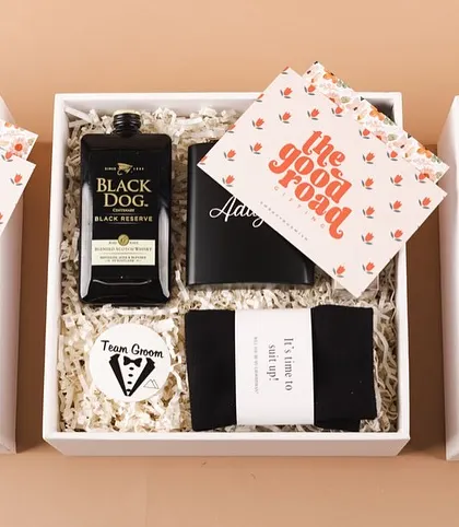 Another shot of the groomsmen gift boxes, highlighting the custom "The Good Road" notecards that add a personal touch from the groom.