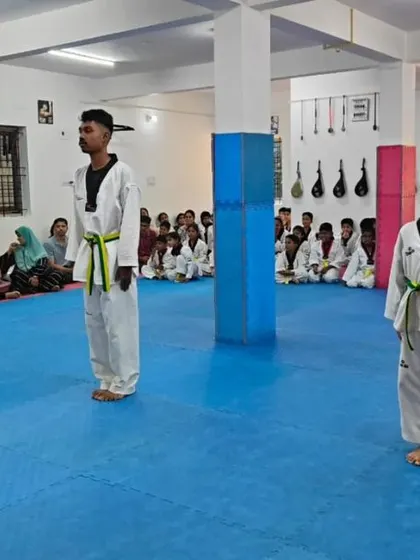 A group of students stand ready for their belt exam.
