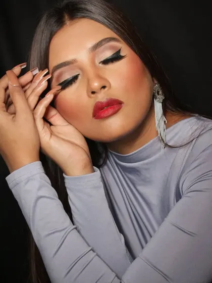 An eyes-closed shot to showcase the clean eyeliner and eyeshadow blending.