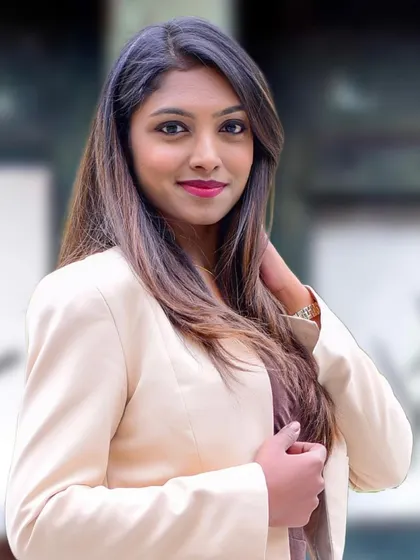 A professional headshot showcasing a polished and confident look suitable for any corporate environment.