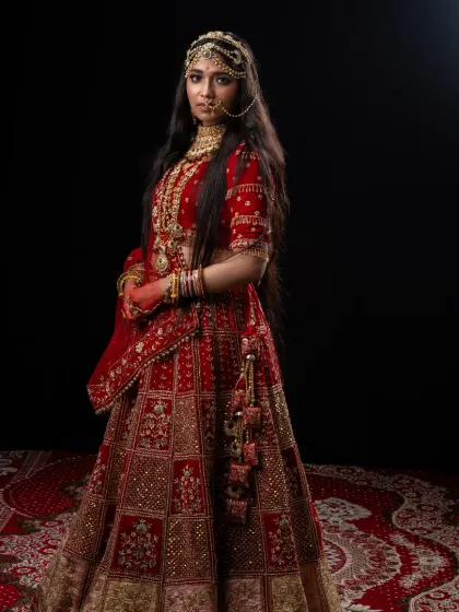 A full-length portrait of the magnificent Padmavathi costume. This rental includes the heavily embroidered red lehenga and all the traditional jewelry for an authentic royal look.