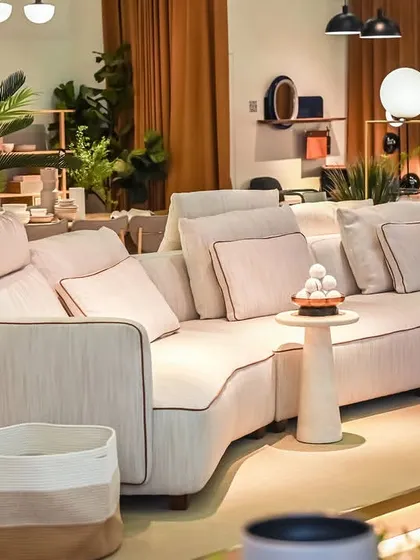 This view of the Montserrat Sofa highlights its elegant curves and modular flexibility. Paired with natural textures and indoor plants, it helps create a living space that feels both sophisticated and grounded.