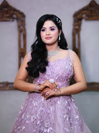 This image captures the intricate details of the gown's bodice and the delicate hair accessories that complete the look.