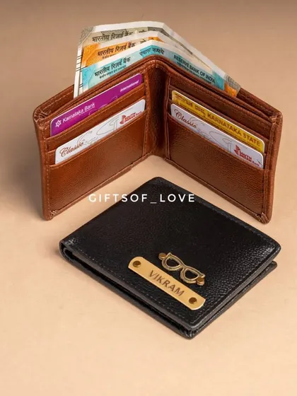 This image shows the interior of the tan executive wallet, which has two cash slots and six card slots, alongside a personalized black wallet.
