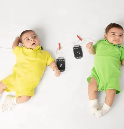 Two best buddies ready to share their lives. This adorable shot of two older babies celebrates their bond with a cute and simple setup.