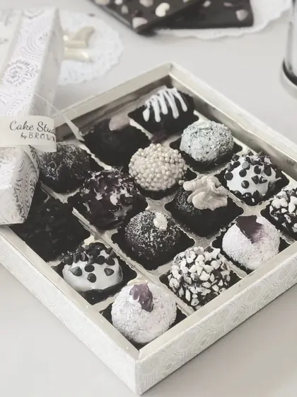 Our black and white themed chocolate truffle box. This elegant silver and white packaging is perfect for sophisticated corporate gifts, filled with a delicious assortment of our handmade truffles.