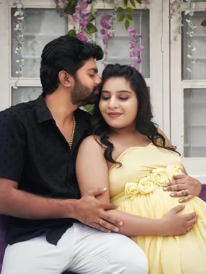 A sweet kiss on the forehead. These are the tender moments we love to capture, celebrating your journey together.