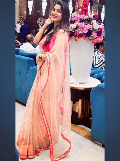 My love for sarees is never-ending. This peach-colored net saree with a simple border is a delicate and graceful choice for a daytime wedding event or a Roka ceremony.