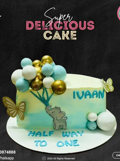 Halfway to one! This elegant half-birthday cake features a cute elephant holding a bouquet of blue and gold balloons, with delicate butterfly accents for a touch of whimsy.