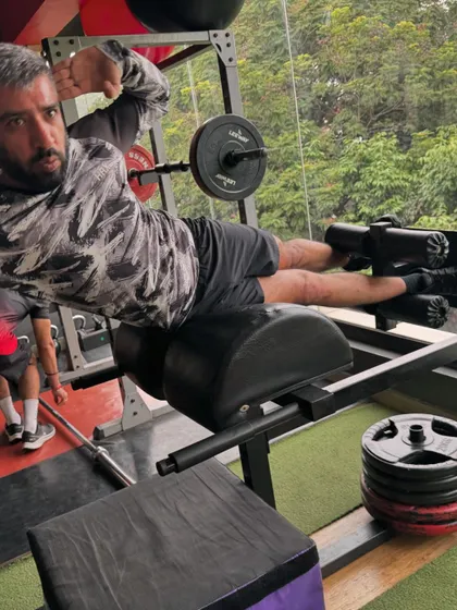 A side glute raise on the GHD machine, targeting the gluteus medius to improve hip stability and prevent knee injuries.