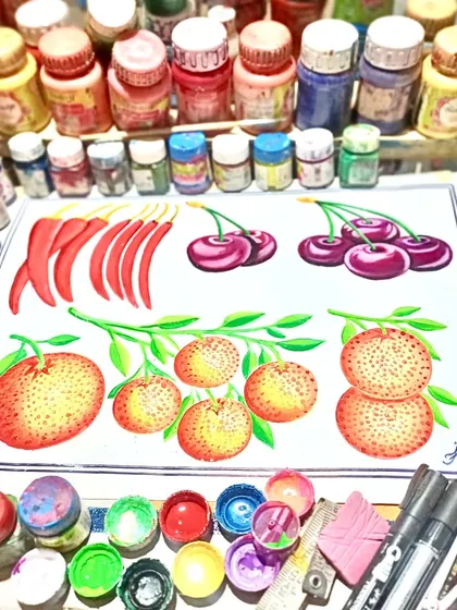 A colorful still life painting of chilies, cherries, and oranges, surrounded by my bottles of paint. This shows the vibrant palette I work with.