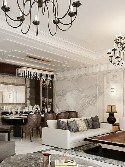 Another view of the Civil Lines villa, showcasing the open-plan living and dining area. The space is unified by coffered ceilings and luxurious marble, with distinct zones created through furniture grouping and lighting.