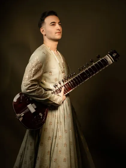 A regal portrait in a custom Jigar Mali outfit, showcasing a royal and elegant aesthetic suitable for high-end weddings and galas.