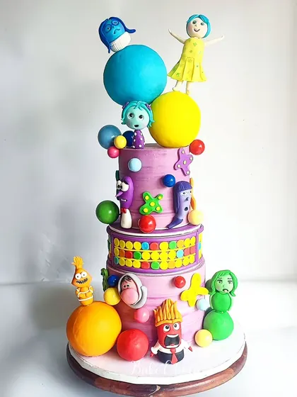 This 'Inside Out' movie cake is one of the most complex and special cakes I've ever made. This multi-tiered creation features all the emotion figurines, each handcrafted with incredible detail for a true fan.