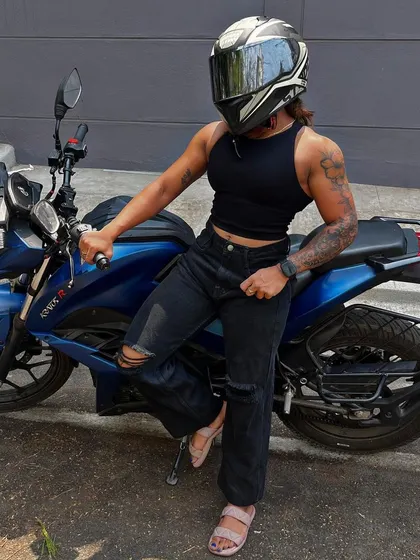 Ready to ride. My helmet is on, but the muscles are still visible. Fitness is part of who I am in every activity.