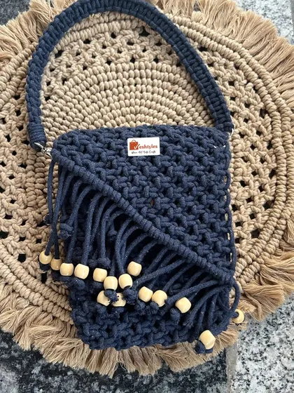 This dark blue version of my small handbag features wooden beads and a sturdy strap, making it both stylish and practical.