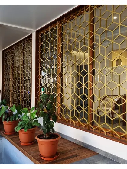 The geometric pattern of the window grills is a recurring motif, bringing a sense of unity to the building's exterior design.