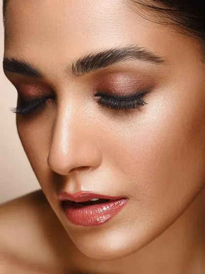 This image captures a serene moment, focusing on the subtle shimmer of the eyeshadow and the smooth texture of the skin. It demonstrates my ability to create gentle and elegant beauty portraits.