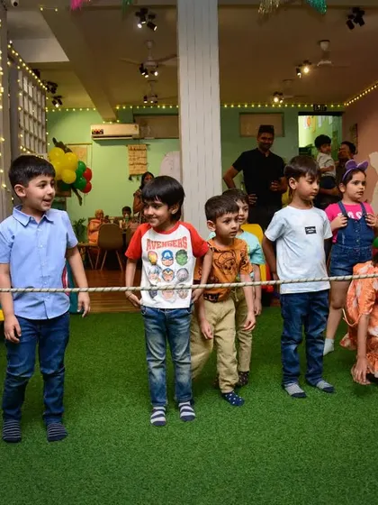 The kids line up, ready and waiting for their turn to go under the limbo rope. The anticipation is half the fun.