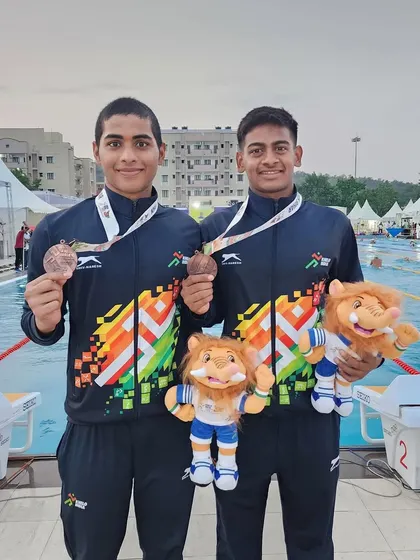 Sampath Gotteti and Theerthu Mongam with their medals.